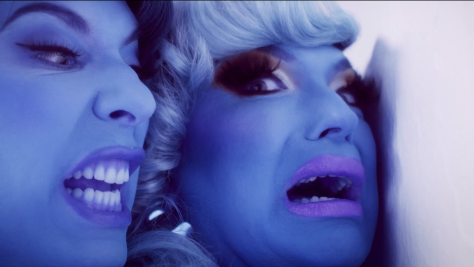 Alaska and D'Arcy Drollinger in a blue-lit close-up from Lady Champagne