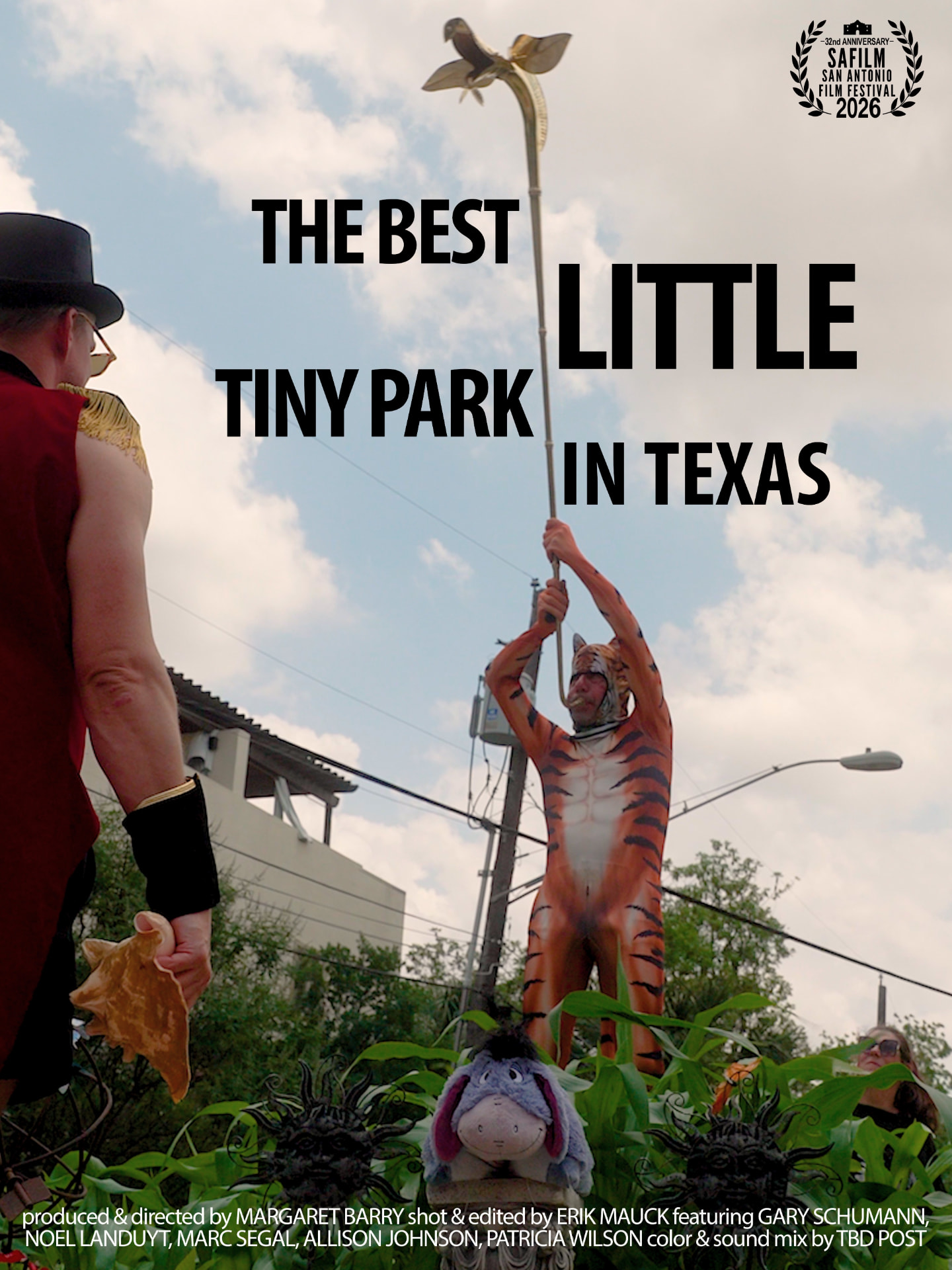 The Best Little Tiny Park in Texas poster: a person in a tiger bodysuit raising a bird-topped staff at BEPI Park