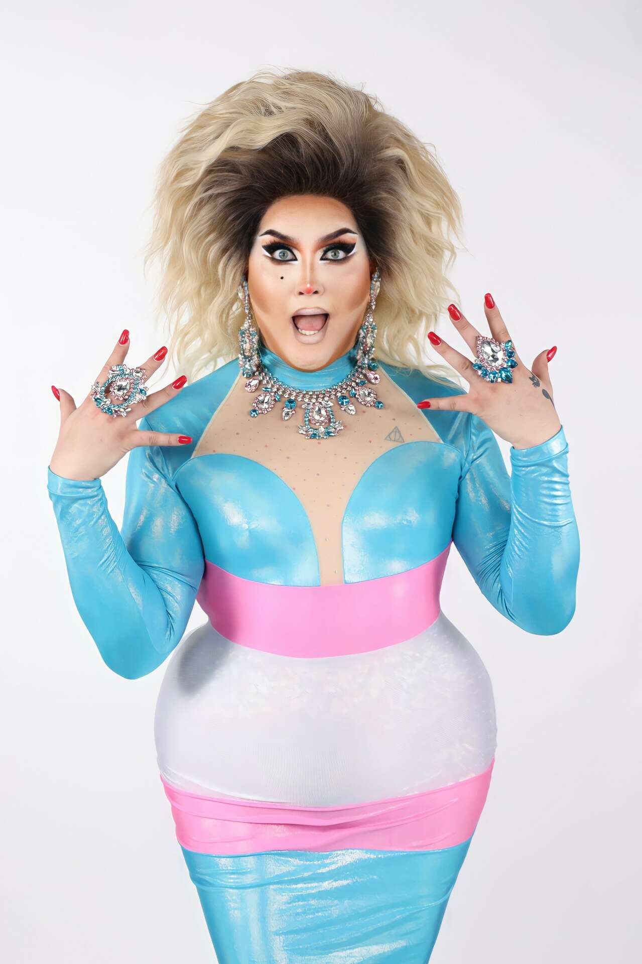 Drag performer Maxine LaQueene in a blue and pink metallic gown