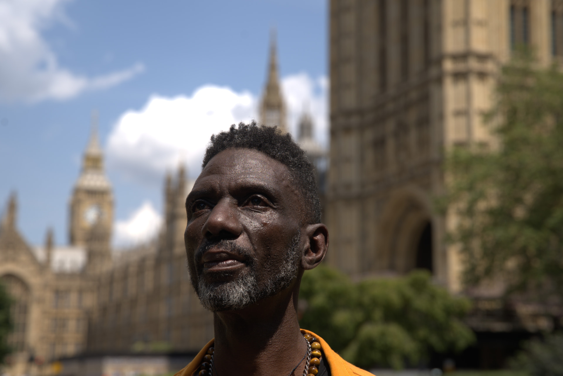 Friedel Dausab outside the Houses of Parliament in London, from Out Laws (credit: Emily N. Kanga)