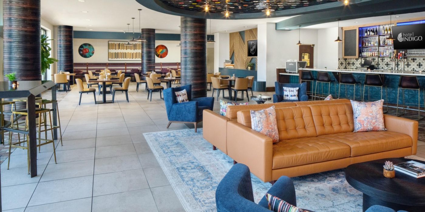 Urban Pour Social dining room at Hotel Indigo Austin with a vinyl record ceiling and neon accents