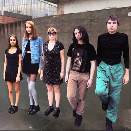 The five members of Painterly standing outside a concrete stairwell